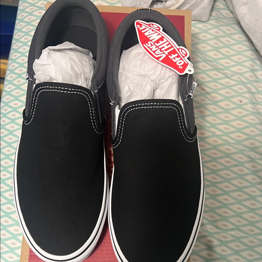 Vans Men's Black and White Slip-On Sneakers